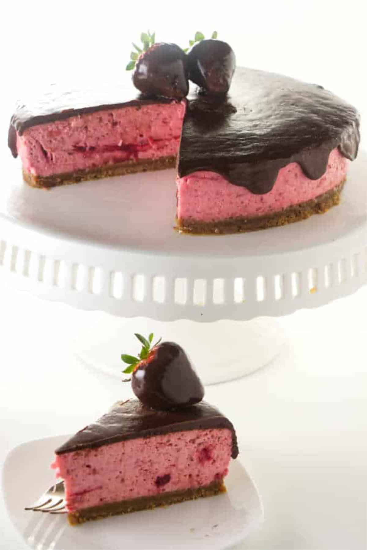 slice of strawberry cheesecake covered with chocolate ganache and a chocolate dipped strawberry.