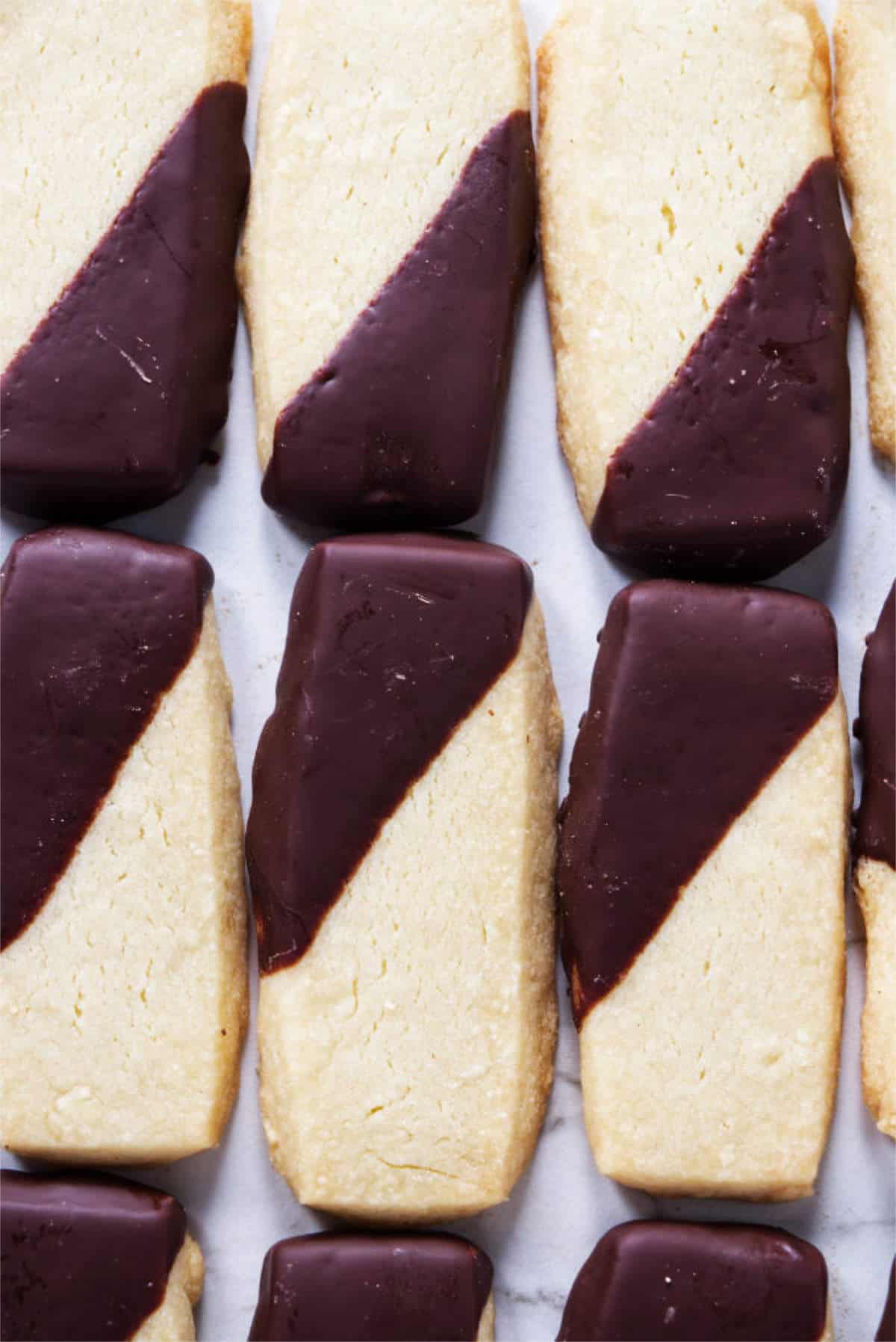 rectangular shortbread cookies dipped in dark chocolate.